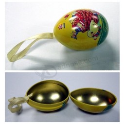 an Egg Shaped Metal Tin with Ribbon Custom