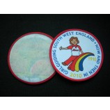 Factory direct wholesale customized top quality Round Shape Paper Backing Overlocking Woven Badge