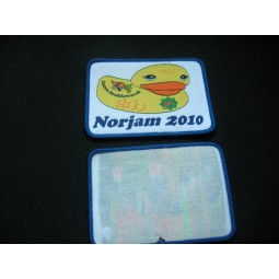 Factory direct wholesale customized top quality Duck Design Paper Backing Merrow Border Woven Badge