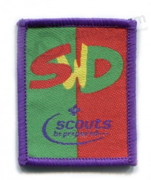 Usine directe en gros personnalisé haut de gamme violet surJetant frontière vêtement patchs tissés