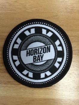 Wholesale customized high-end Round Shape Black Overlocking Woven Badge