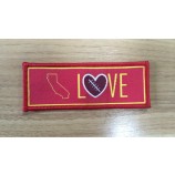 Wholesale customized high-end Red Overlocking Clothing Woven Badge