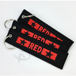 cheap custom embroidery fabric key tag with merrow border