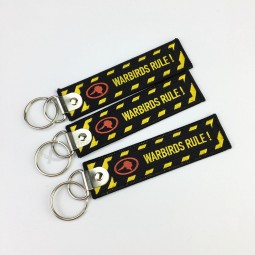 Wholesale Custom Brand Name Promotional Travel Souvenir Woven Embroidery Logo Fabric Keychains with your logo