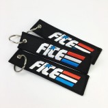 Custom black coloring eyelet overlock embroidery woven keychain with high quality and any size