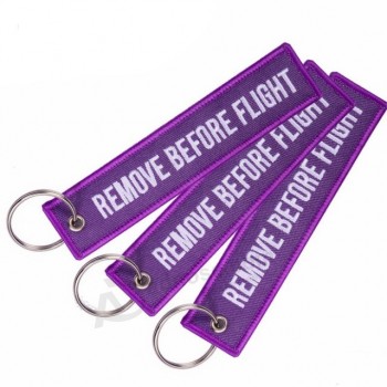 ファッションタグキーチェーン紫の刺繍キーフォブは、飛行の前にキーチェーンタグを削除します