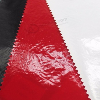 Gebonden pu weerspiegelt lederen op maat gemaakte stof voor kleding