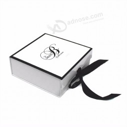 white cardboard packing box with black logo