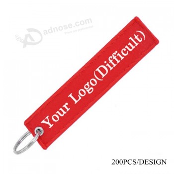 customized remove luggage Tag label before flight embroidery keychain