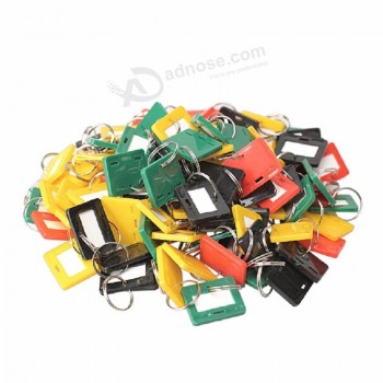 bagaglio portachiavi in ​​plastica semplice da 100 pezzi Tag chiave 4 nome etichetta ID stile Tag chiave Portachiavi anello diviso portachiavi