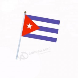 Stock Cuba hand waving election flag with black plastic pole