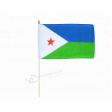 Djibouti hand waving flag with wood poles