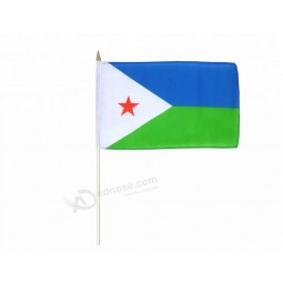 Djibouti hand waving flag with wood poles