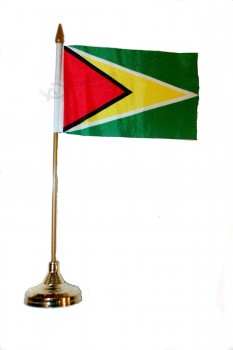 guyana small 4 X 6 inch mini country stick flag banner with gold stand on a 10 inch plastic pole