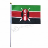 kenya country hand held waving flag with sticks
