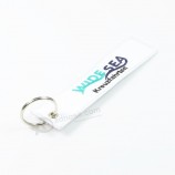 Custom white embroidery cool keychains with three colors on logo