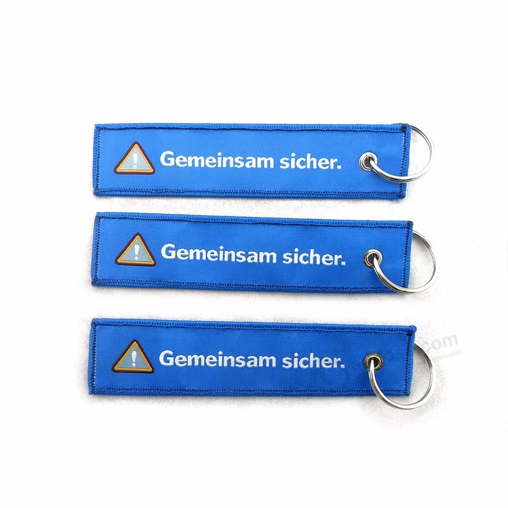 Kundenspezifisches Logo gesponnenes keychain Stickereigroßverkauf Fördernde Verwendung Andenkenbaumwollhochzeit gesponnenes keychain