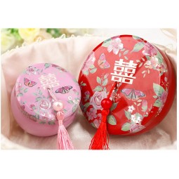 Boîte de cadeau de mariage rouge de style chinois créatif et de personnalité, boîte-cadeau ronde en étain avec de jolis glands