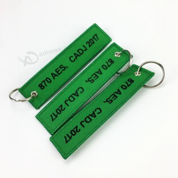 Keychain bordado feito sob encomenda relativo à promoção para a porta-chaves por atacado seu projeto do logotipo aceitado