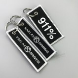 O logotipo personalizado frente e verso merrow bordou o keychain bordado por atacado