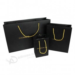 Diseño lujoso regalo de oro negro llevar embalaje logotipo personalizado impreso bolsa de papel de compras