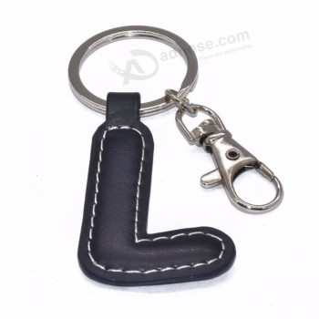 Etiqueta de llavero de cuero de PU de metal de moda caliente + llavero de cuero de aleación de zinc de letra para llave de coche