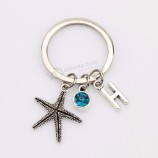 New Charm Starfish Birthstone Pendant Keychain Trinket Alloy Custom Initials Bag Key Ring Holder for Women Gift Souvenir Jewelry