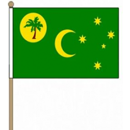 Handflagge der zujubelnden Kokosinseln des Fans für Sport