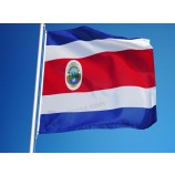 American festival outdoors flying Costa Rica country flags