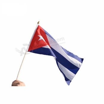cuba bandeiras cubanas mesa mão vara bandeiras