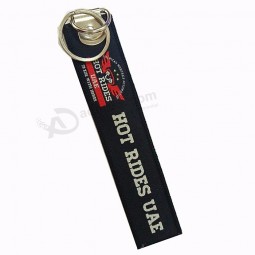 portachiavi in ​​tessuto con logo promozionale souvenir da viaggio di marca