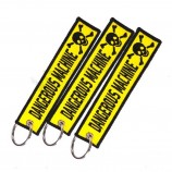 recuerdo promocional de viaje tejido bordado logo tela llaveros