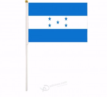 palo della bandiera tenuto in mano di promozione dell'interno dell'Honduras