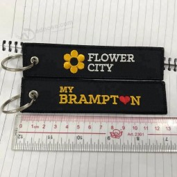 Personalizzato campioni gratuiti economici tessuto equipaggio volo Tag personalizzato logo Key Tag