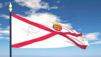 vlag van jersey vliegen tegen een blauwe hemel met bewegende wolken stock footage