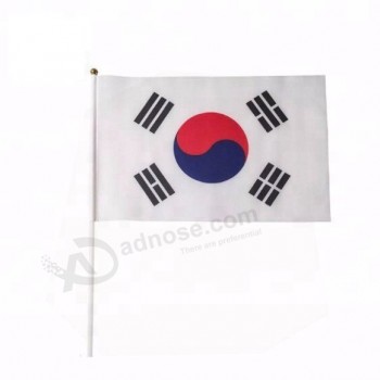 Corea del Norte y la bandera japonesa de poliéster de palo de mano con poste de madera