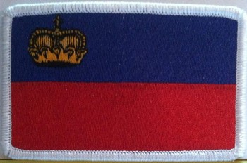 Bandera de Liechtenstein bordado parche de hierro emblema borde blanco