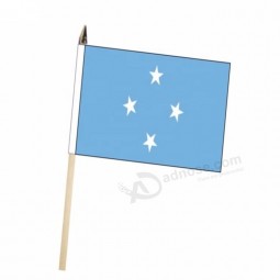 venta al por mayor personalizado mini país estados federados de micronesia ondeando la bandera nacional de mano