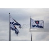 Scania branded flags fly outside the headquarters of Scania