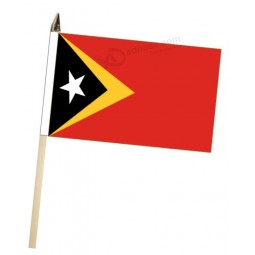 Timor-Leste (Timor oriental) Grande main agitant un drapeau de courtoisie