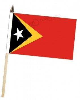 timor-leste (osttimor) große hand mit höflichkeitsflagge