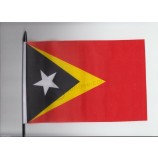 Timor-Leste (Timor oriental) Drapeau agitant à la main