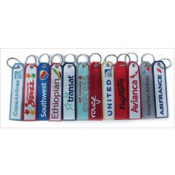llavero con logo bordado personalizado con letra tejida a dos lados