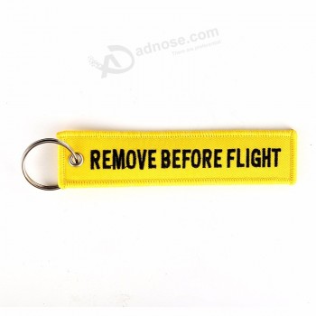 5 PCS / LOT eliminar antes del vuelo llavero sígueme llavero amarillo bordado moda sleutelhanger etiqueta de seguridad joyería llavero