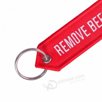 Supprimer avant le vol Chaînes de mode Bijoux de mode pour hommes OEM Porte-clés Chaînes de broderie rouge Aviation Cadeaux Chaveiro