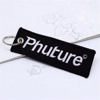 Brodé Imprimer Votre propre logo Étiquette de bagage Fermeture éclair vol Promotion Porte-clés de vol