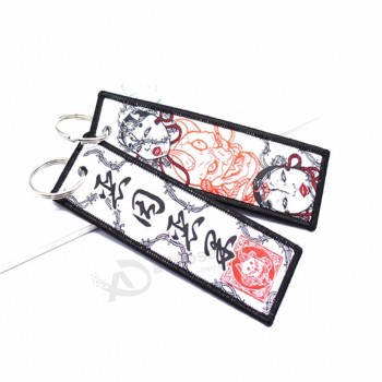 Logo en tissu Polyester Tissé Surjet Broderie Porte-clés promotionnel