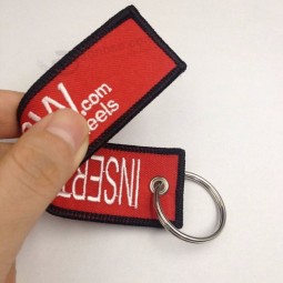 Porte-clés double face broderie personnalisée avant le vol
