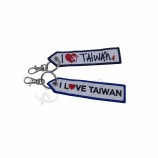 groothandel promotionele aangepaste ontwerp logo borduurwerk gepersonaliseerde sleutelhangers tag