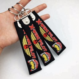 Cheap custom jet fabric key tag/ embroidery keychain with china factory